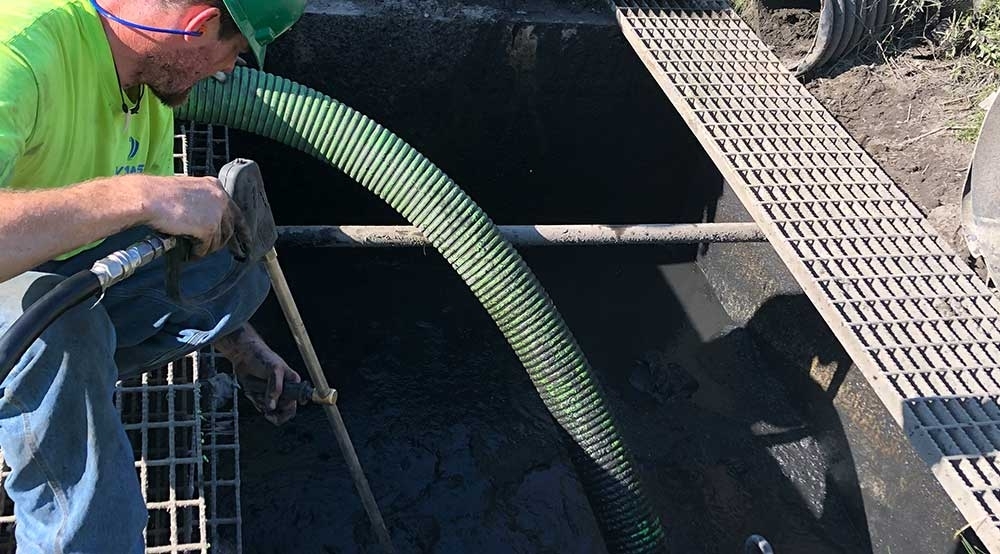 Cleaning Debris from Stormwater Detention Pond Structure